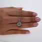 Colombian Emerald Pendant: 0.70 ct tw Emeralds, 0.40 ct tw Diamonds, 14K White Gold